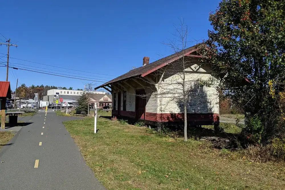 Historic railroad depot beside the paved Redstone Trailway in East Longmeadow, Massachusetts