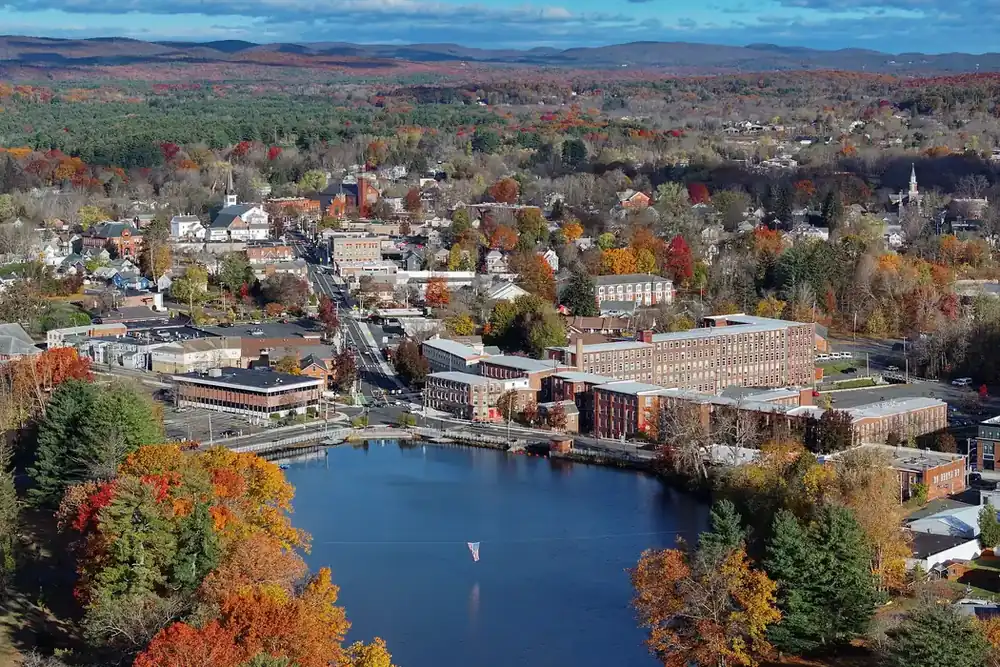 Aerial view of Easthampton, Massachusetts, with Nashawannuck Pond and autumn foliage around downtown
